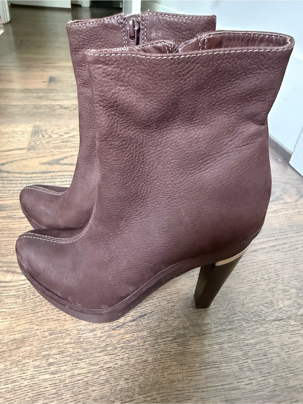 Diane Von Furstenberg brown leather high heel boots with gold trim. Worn once.